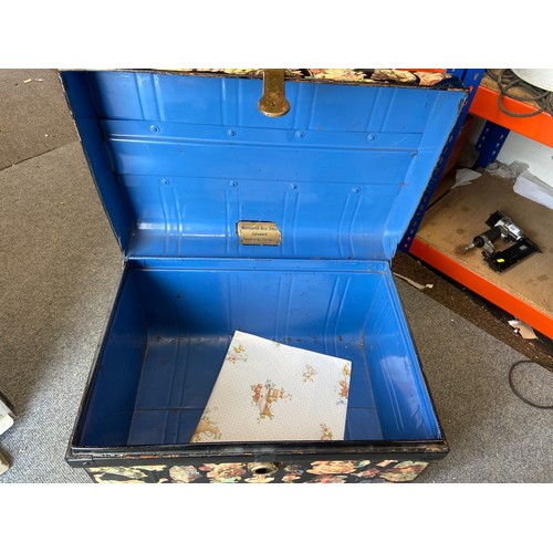 705 - Japanned steel travelling trunk with decoupage decoration outside and blue inside.  70 x 51 x 45 cms