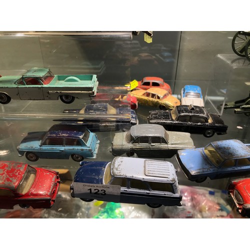 123 - Assorted play worn Dinky & Corgi cars & others plus a number of die cast military carriages ... 