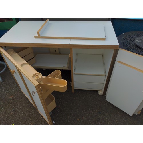 103 - Horn sewing machine cabinet and work station with foldout work space/cutting table and electric sewi... 