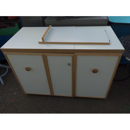 103 - Horn sewing machine cabinet and work station with foldout work space/cutting table and electric sewi... 