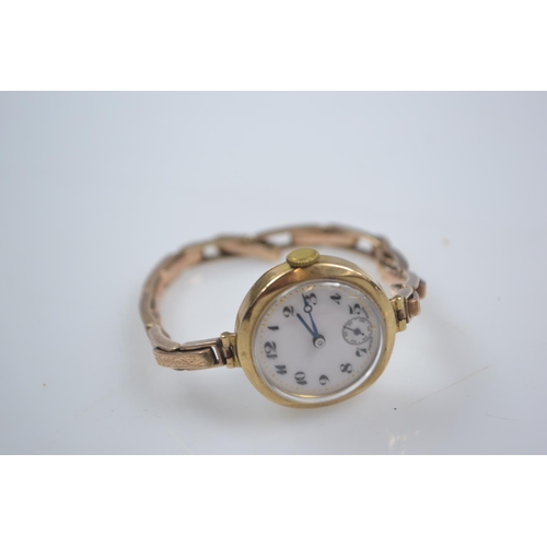 44 - 9ct gold cased ladies watch on 9ct gold sprung link strap, subsidiary seconds and enamel face dia. 2... 