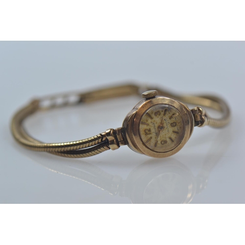 45 - 9ct gold cased Accurist cocktail watch, 21 Jewels, on 9ct gold strap, 14mm x 17mm face, gross weight... 