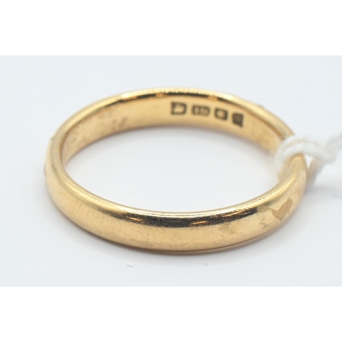 62 - 18ct gold band, size R, gross weight 4.90 grams