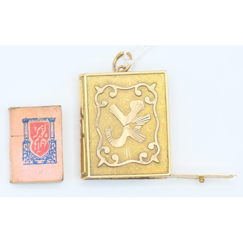 67 - Yellow metal (testing as high grade) prayer book pendant 6.3g