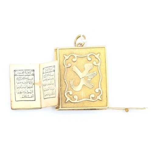 67 - Yellow metal (testing as high grade) prayer book pendant 6.3g