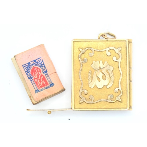 67 - Yellow metal (testing as high grade) prayer book pendant 6.3g