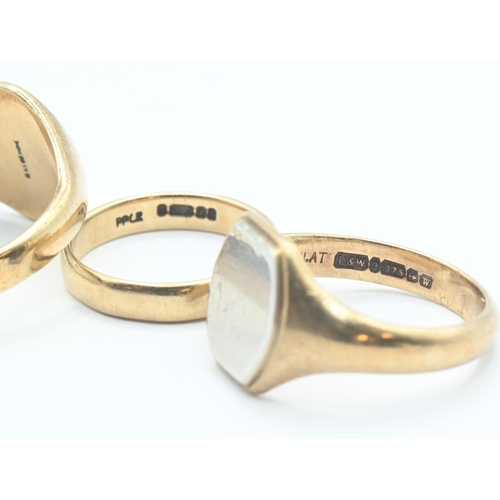 73 - Two 9ct gold signet rings and a gold band. Sizes Y, S/T & L respectively. Gross weight 16.93g