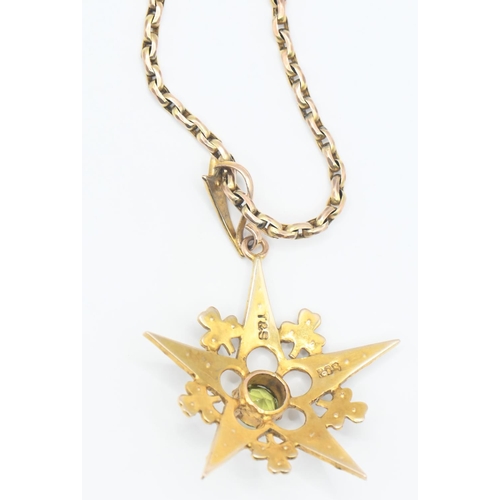 92 - Edwardian 9ct gold starburst pendant set with peridot and seed pearls. 9ct gold chain 430mm circumfe... 