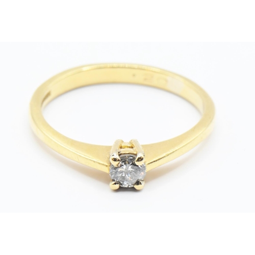 93 - 18ct gold and diamond solitaire ring. Marked .20 carat. gross weight 2.41g Size L/M.