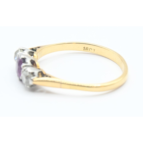 105 - 18ct gold ring set with central ruby, flanked with two old cut diamonds. Size O/P. Gross weight 2.5g