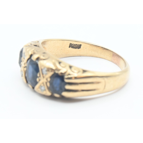 106 - 9ct gold trilogy ring set with topaz and small diamonds. gross weight 4.07g. Size M/N