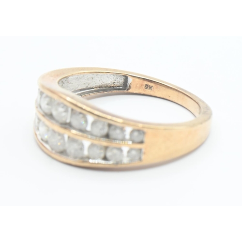 114 - 9ct gold ring channel set with two rows of diamonds (18 total). Size O/P. Gross weight 3.2g