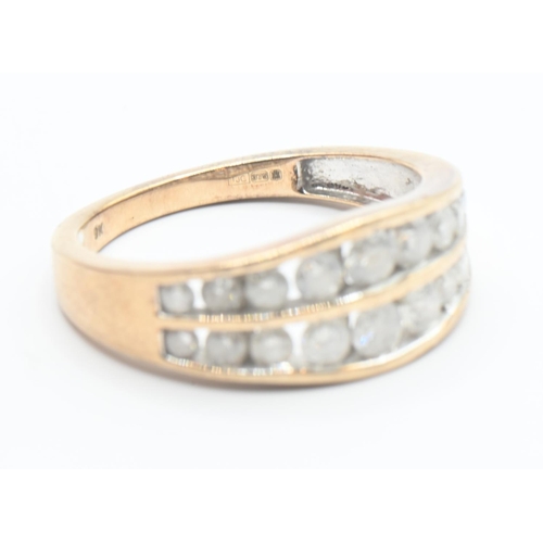 114 - 9ct gold ring channel set with two rows of diamonds (18 total). Size O/P. Gross weight 3.2g