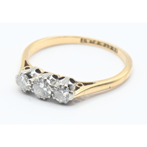 116 - 18ct gold and diamond trilogy ring featuring three brilliant cut diamonds mounted in platinum. Size ... 