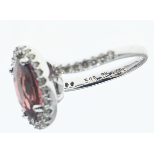 117 - 14ct white gold, tourmaline and diamond halo  ring, size O, gross weight 5.57 grams