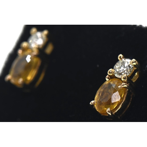 119 - Pair of 18ct gold, yellow sapphire and diamond earrings, length 9mm, gross weight 1.76 grams