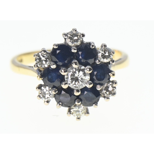 120 - Sapphire and diamond cluster ring central diamond 3.5mm diameter, size K 1/2. Gross weight 3.64g.