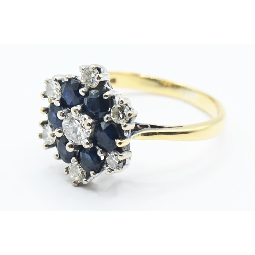 120 - Sapphire and diamond cluster ring central diamond 3.5mm diameter, size K 1/2. Gross weight 3.64g.