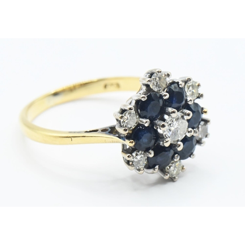 120 - Sapphire and diamond cluster ring central diamond 3.5mm diameter, size K 1/2. Gross weight 3.64g.