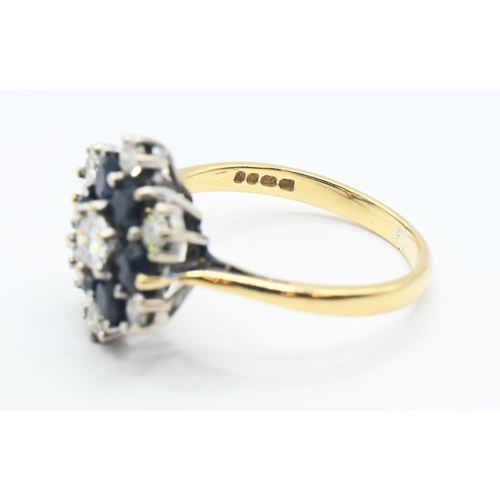 120 - Sapphire and diamond cluster ring central diamond 3.5mm diameter, size K 1/2. Gross weight 3.64g.