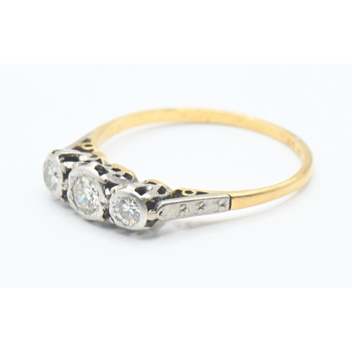 121 - 18ct gold and diamond trilogy ring Size M/N. Gross weight 1.8g.