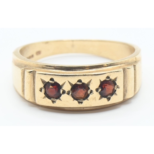 122 - 9ct gold ring set with three garnets, size R/S, gross weight 4 grams