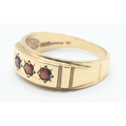 122 - 9ct gold ring set with three garnets, size R/S, gross weight 4 grams