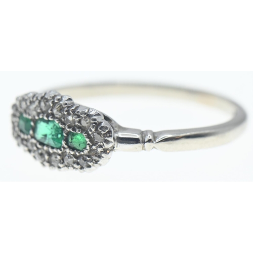 124 - 18ct white gold, emerald and diamond ring, size N, gross weight 2.9 grams