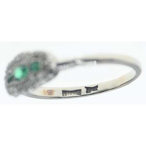 124 - 18ct white gold, emerald and diamond ring, size N, gross weight 2.9 grams