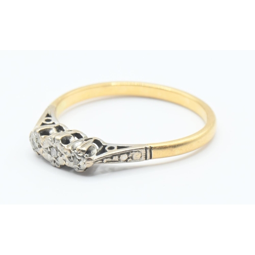 125 - 18ct gold and diamond trilogy ring. Size N, gross weight 2.3g.