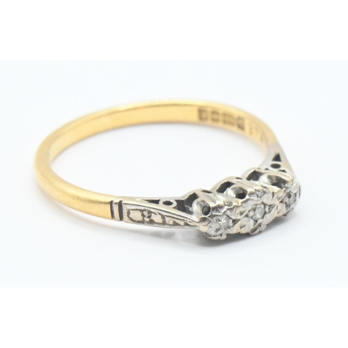 125 - 18ct gold and diamond trilogy ring. Size N, gross weight 2.3g.