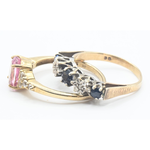 130 - Two 9ct gold rings one set with central oval pink topaz flanked with white stones, size O/P and blue... 