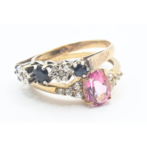 130 - Two 9ct gold rings one set with central oval pink topaz flanked with white stones, size O/P and blue... 