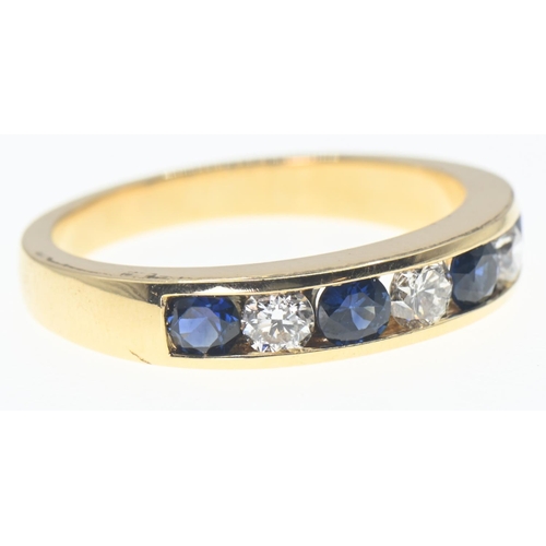 135 - 18ct gold, diamond and sapphire half hoop ring, size O, gross weight 4.66 grams