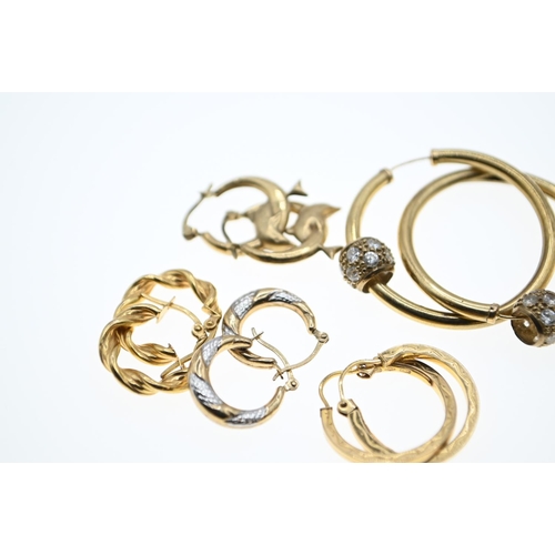 143 - Three pairs of 9ct gold hoop earrings, gross weight 2.7 grams together with two pairs of yellow meta... 