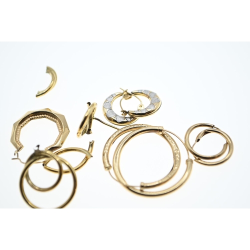 147 - Three pairs of yellow metal hoop earrings together with additional scrap yellow metal earrings, all ... 