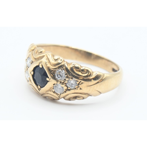 153 - 9ct gold ring set with dark blue and white stones. Size M, gross weight 2.8g