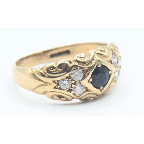 153 - 9ct gold ring set with dark blue and white stones. Size M, gross weight 2.8g