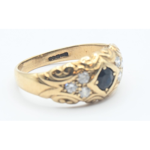 153 - 9ct gold ring set with dark blue and white stones. Size M, gross weight 2.8g