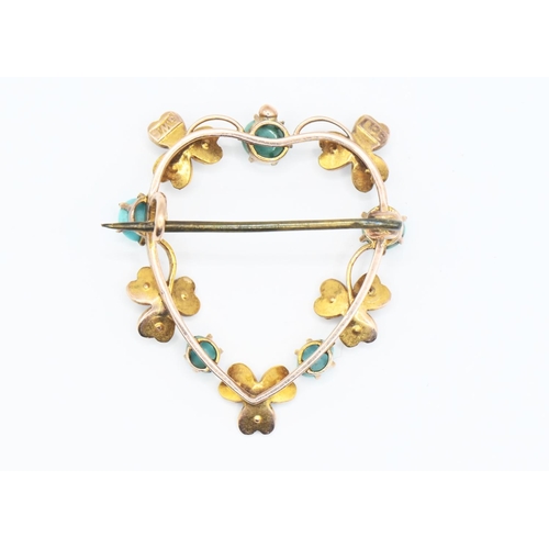 155 - 9ct gold heart shaped brooch set with seed pearls. Marked GWS 9ct. Gross weight 2.4g