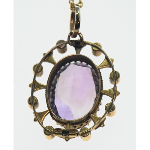 164 - Oval cut amethyst (approx. 20mm x 15mm) & seed pearl yellow metal pendant (converted from a broo... 