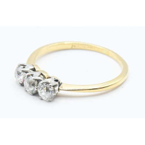 206 - Diamond trilogy ring on yellow metal (rubbed hallmark) testing positive at 18ct. Featuring 3 old cut... 