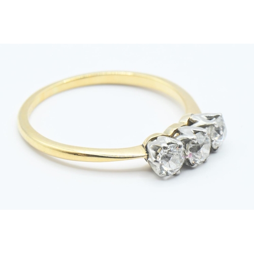 206 - Diamond trilogy ring on yellow metal (rubbed hallmark) testing positive at 18ct. Featuring 3 old cut... 