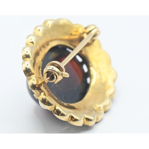 218 - 9ct gold brooch set with oval cabochon garnet 15mm x 10mm and split seed pearls (one missing). gross... 