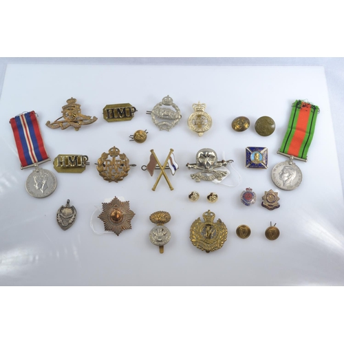 357 - WWII Defence medal and 1939-1945 war medal together with assorted cap badges, buttons and fabric bad... 