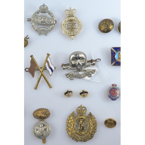 357 - WWII Defence medal and 1939-1945 war medal together with assorted cap badges, buttons and fabric bad... 