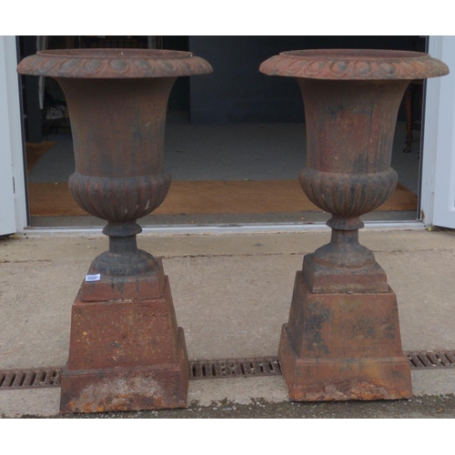 418 - Two cast iron garden urns. Dia 49 cm Height 89 cm