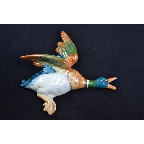 438 - A set of three graduated Beswick flying duck wall pockets 596-2, 3 & 4