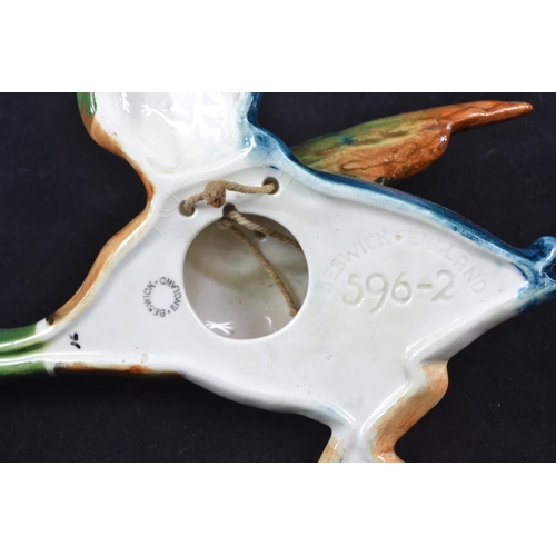 438 - A set of three graduated Beswick flying duck wall pockets 596-2, 3 & 4