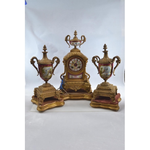 441 - Gilt metal and hand painted porcelain three piece mantle clock garniture, late C19th/early C20th, th... 